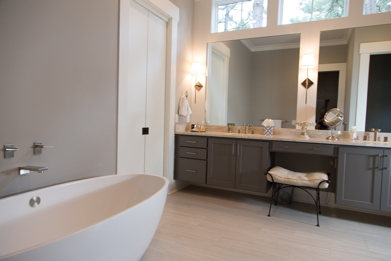 Master bath with a freestanding tub beside a double vanity