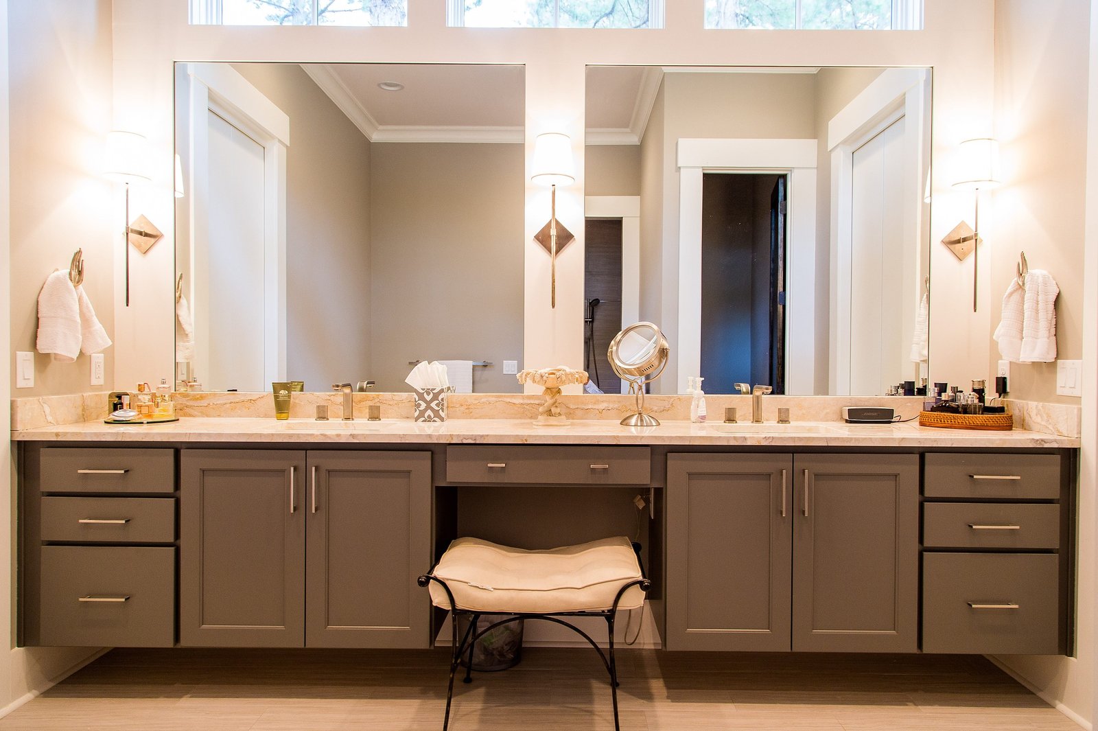 Master bath with a long double vanity and a framed mirror